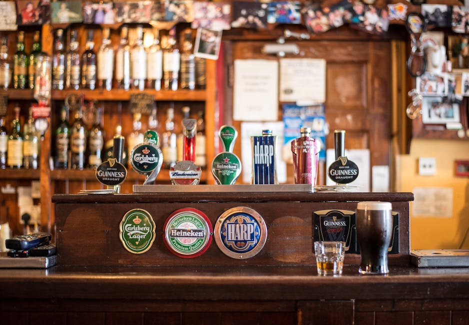 A warm, inviting pub with various beer brands on tap, perfect for social gatherings.